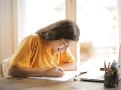 young student writing