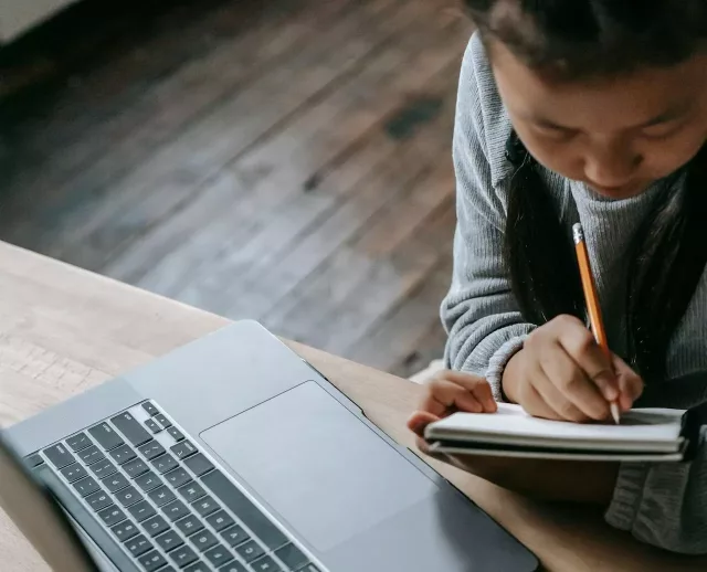 Student taking notes